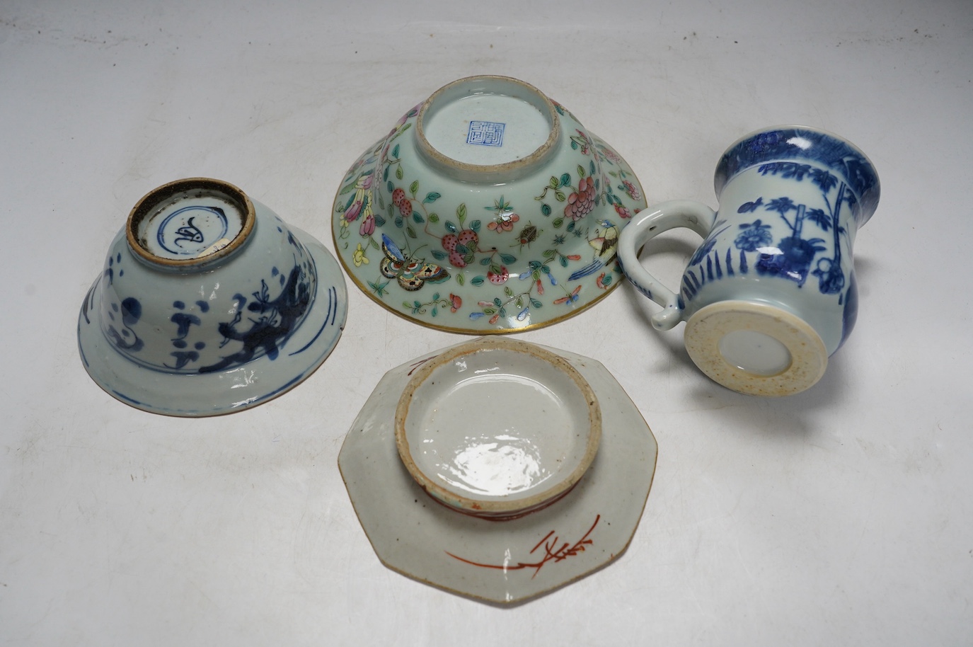 A Chinese blue and white Ming dynasty bowl, a blue and white mug and two pieces of famille rose (4), tallest 12cm. Condition - good